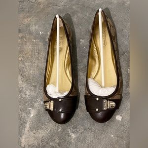 New, never worn COACH shoes.